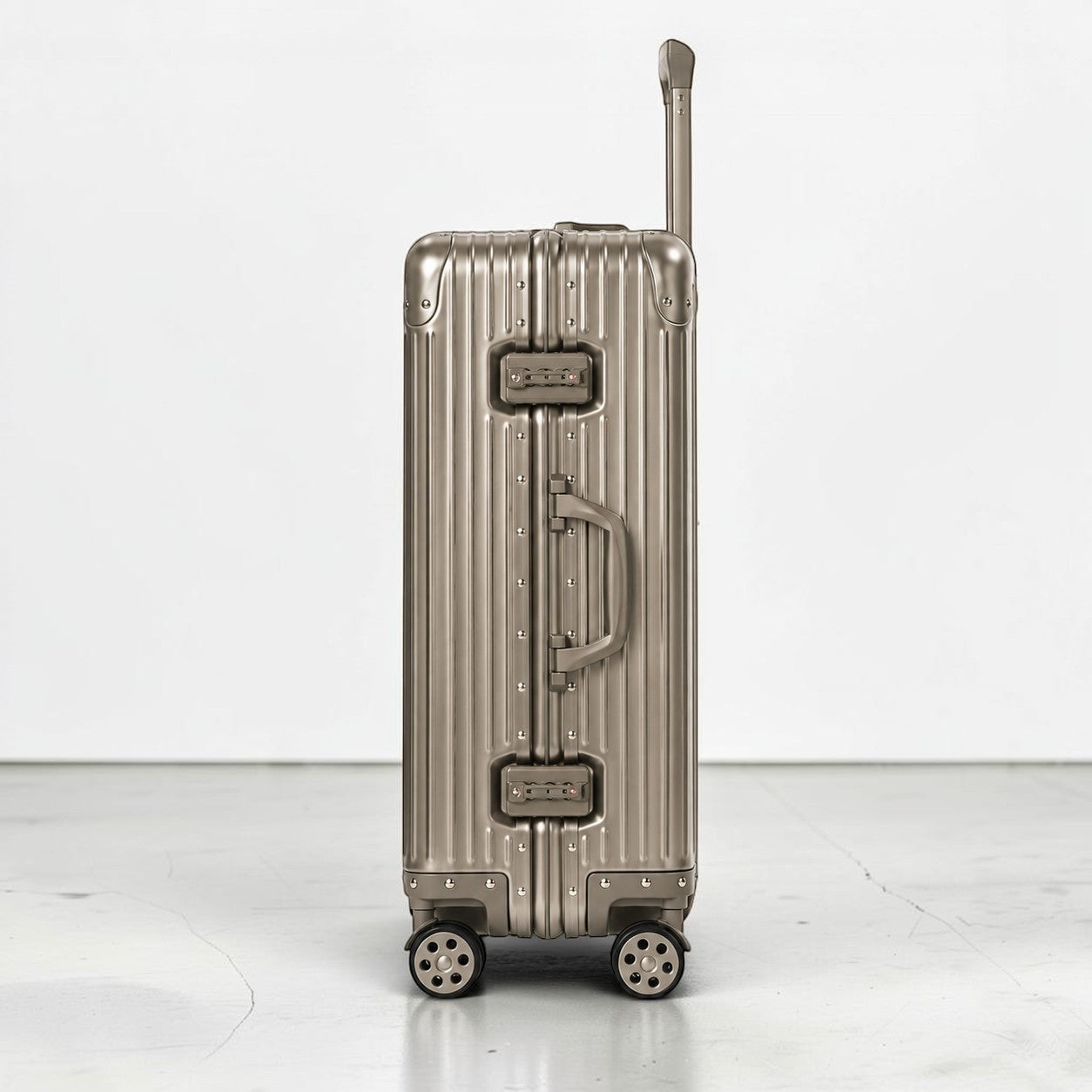 CASE.01 aluminum suitcase in silver with ribbed texture, TSA locks, and retractable handle. Cabin size.
