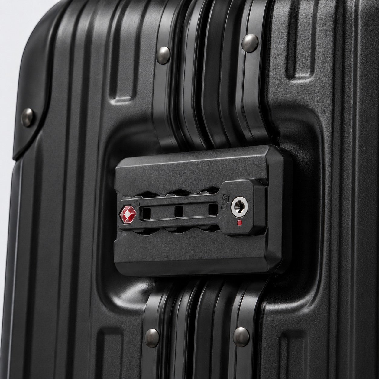 CASE.01 aluminum suitcase with TSA lock and ribbed texture. Black.