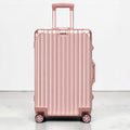 CASE.01 rose gold aluminum suitcase with retractable handle and four spinner wheels.