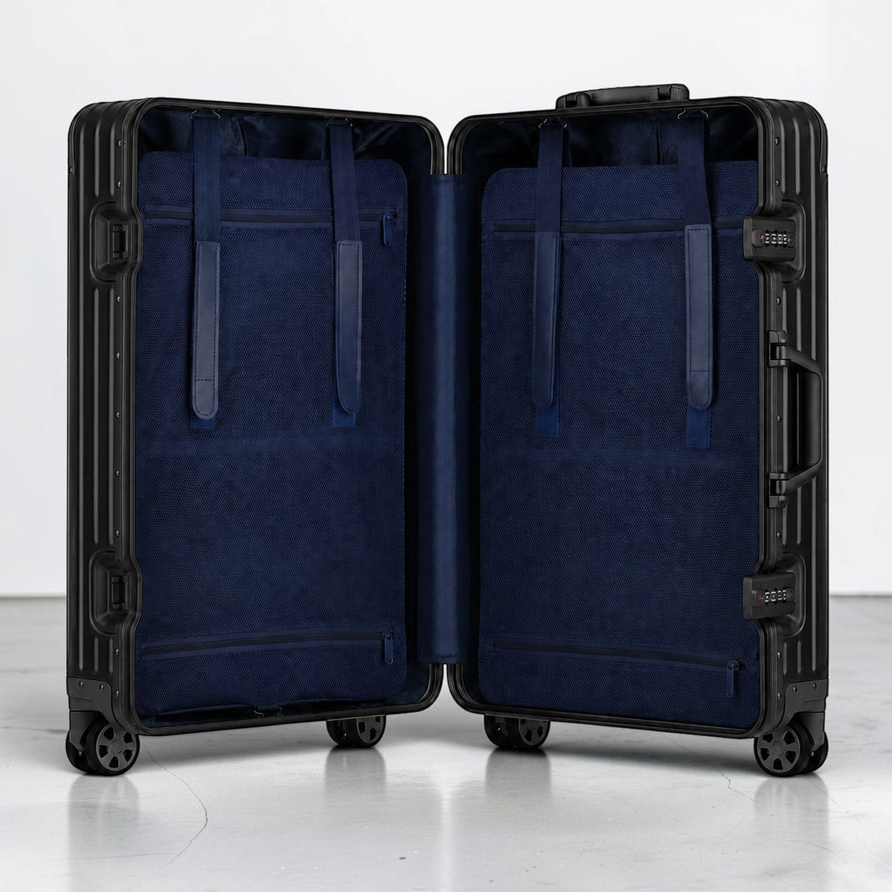 CASE.01 aluminum suitcase with navy blue interior lining and straps, TSA locks, and spinner wheels.