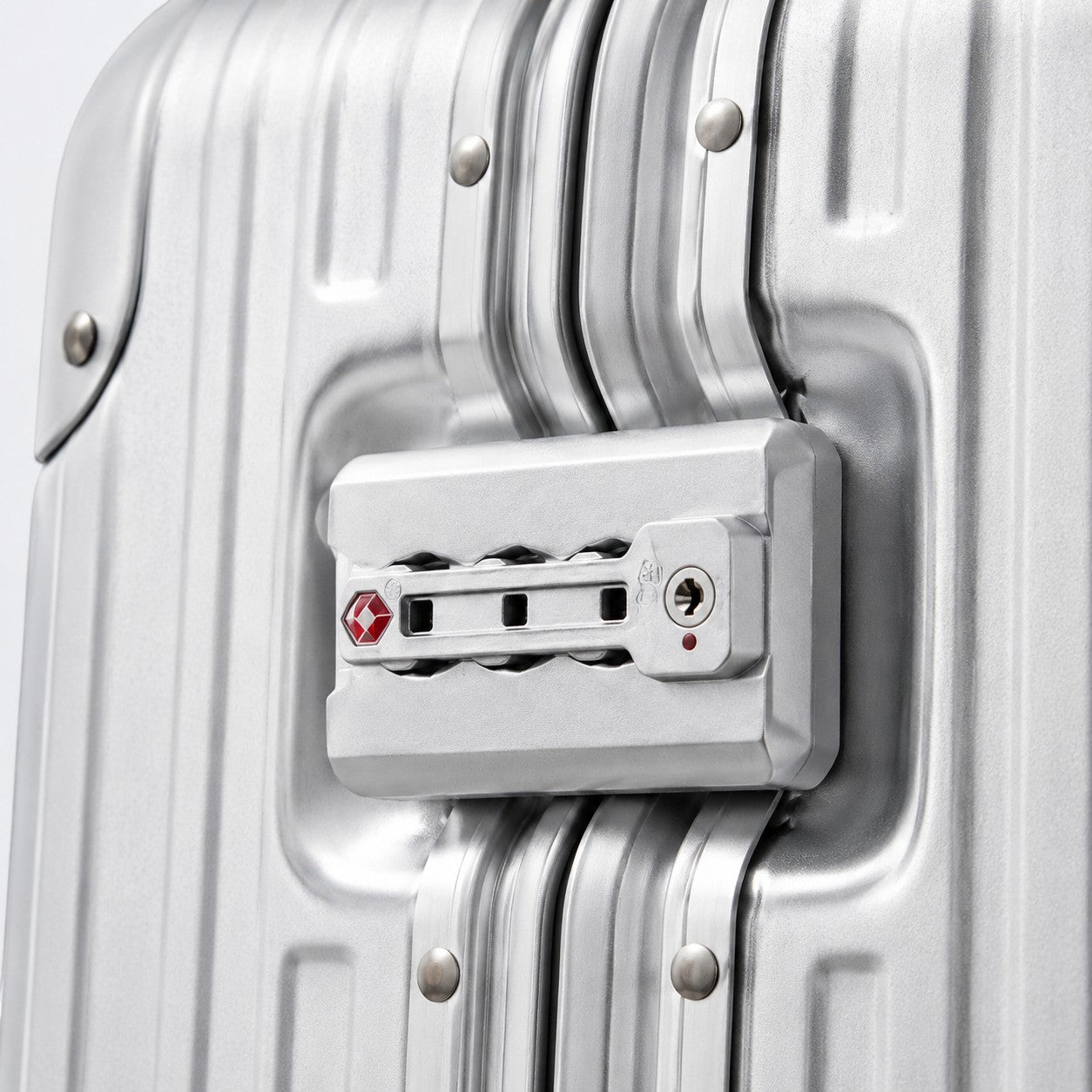CASE.01 aluminum suitcase with TSA lock and ribbed exterior. Silver metal finish.