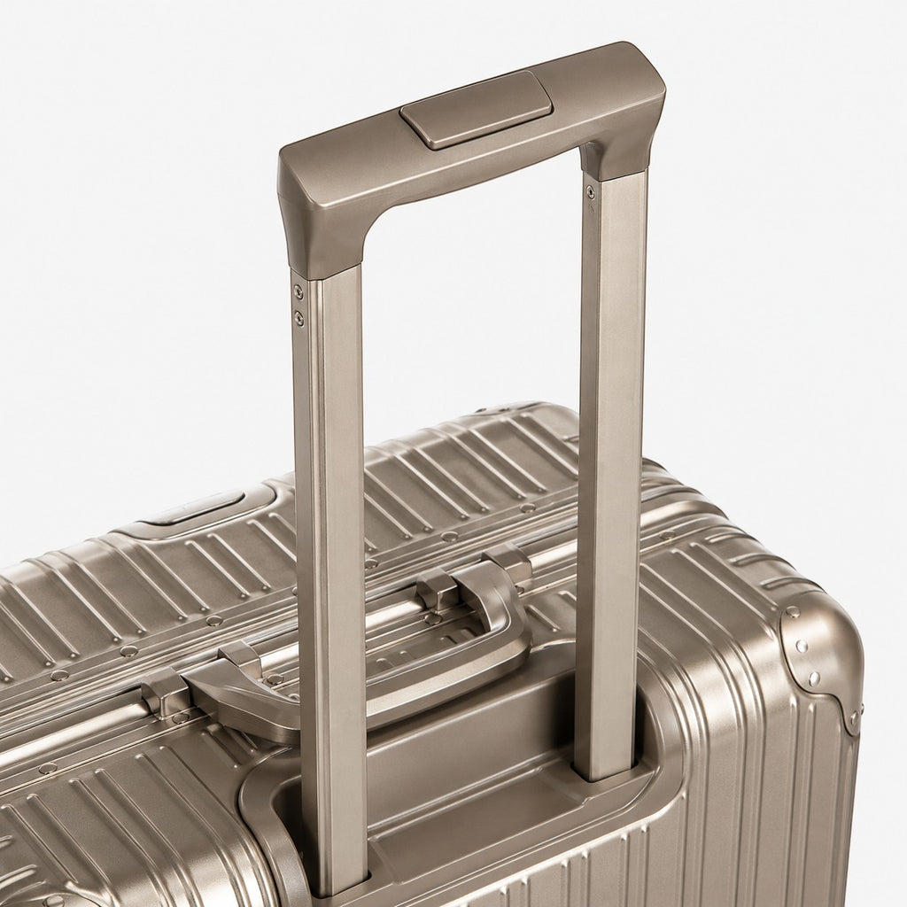 CASE.01 aluminum suitcase with a retractable handle and textured metallic finish. Modern travel luggage.