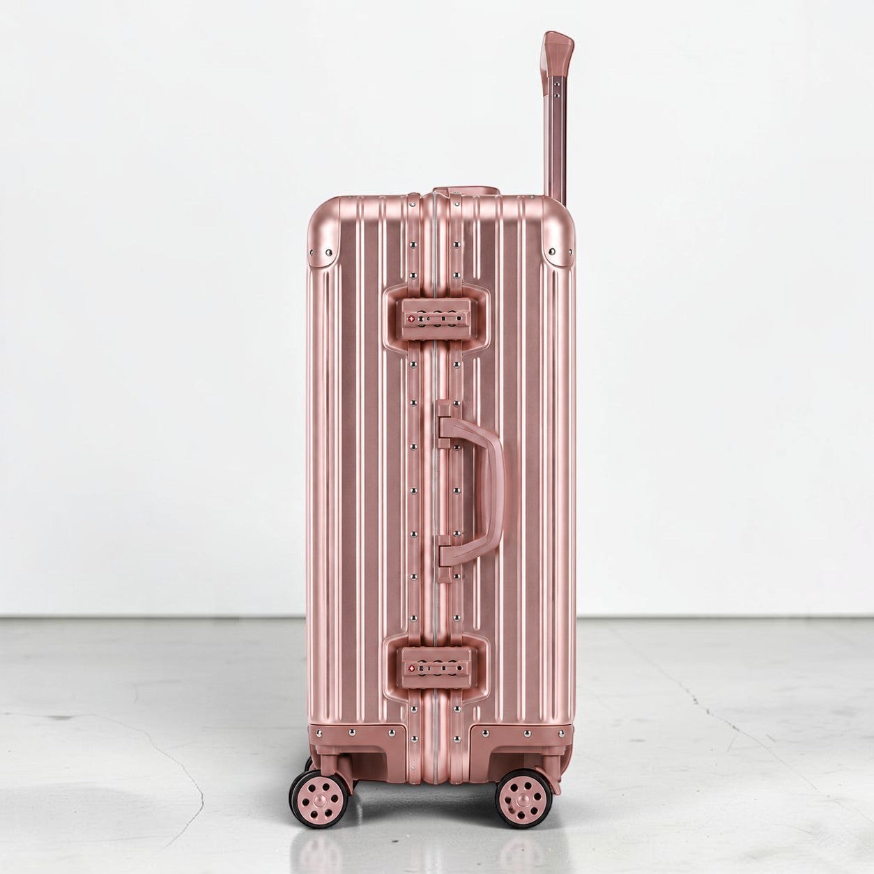 CASE.01 aluminum suitcase in rose gold with TSA locks and retractable handle. Cabin size.