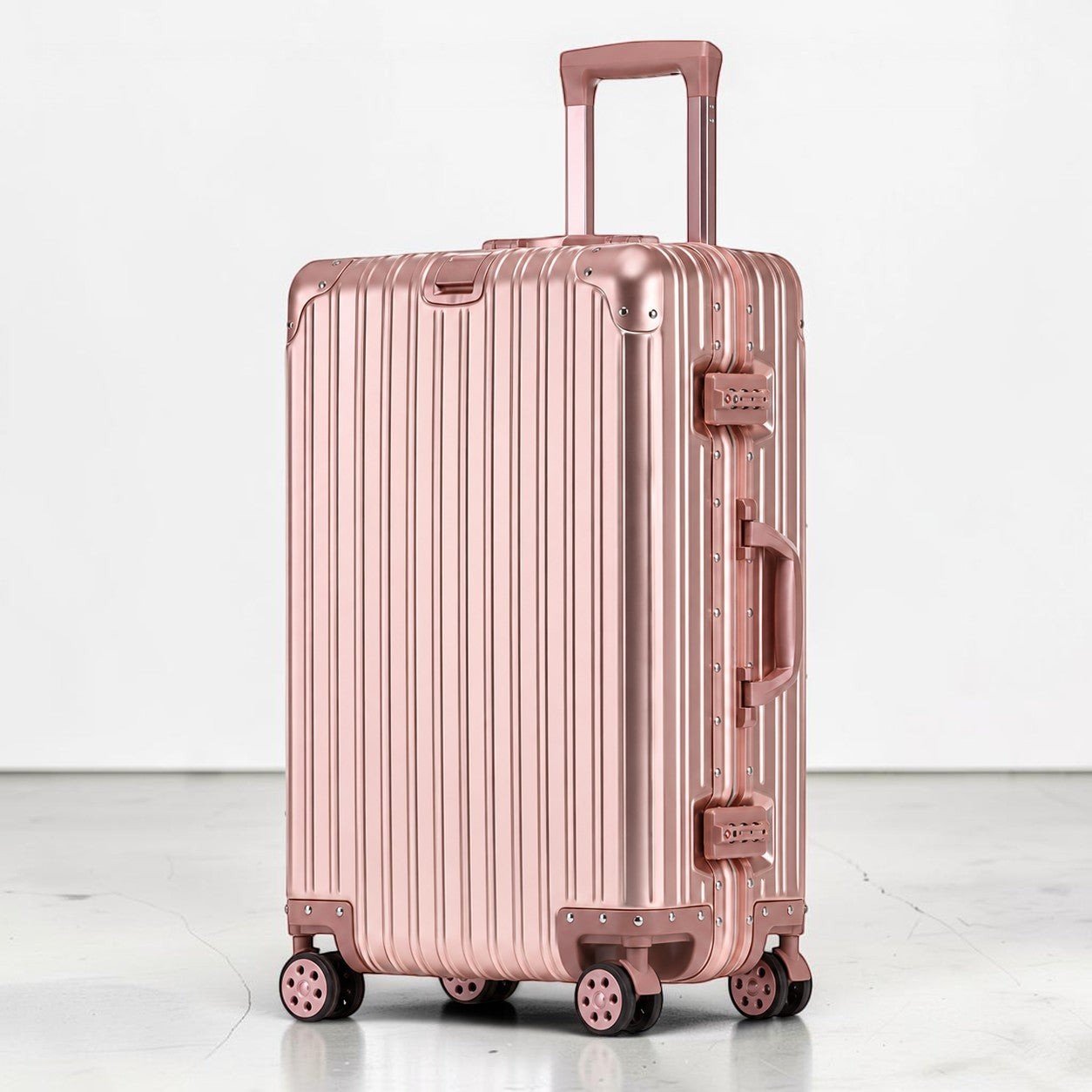 CASE.01 rose gold aluminum suitcase with TSA locks and telescoping handle. Modern travel luggage.
